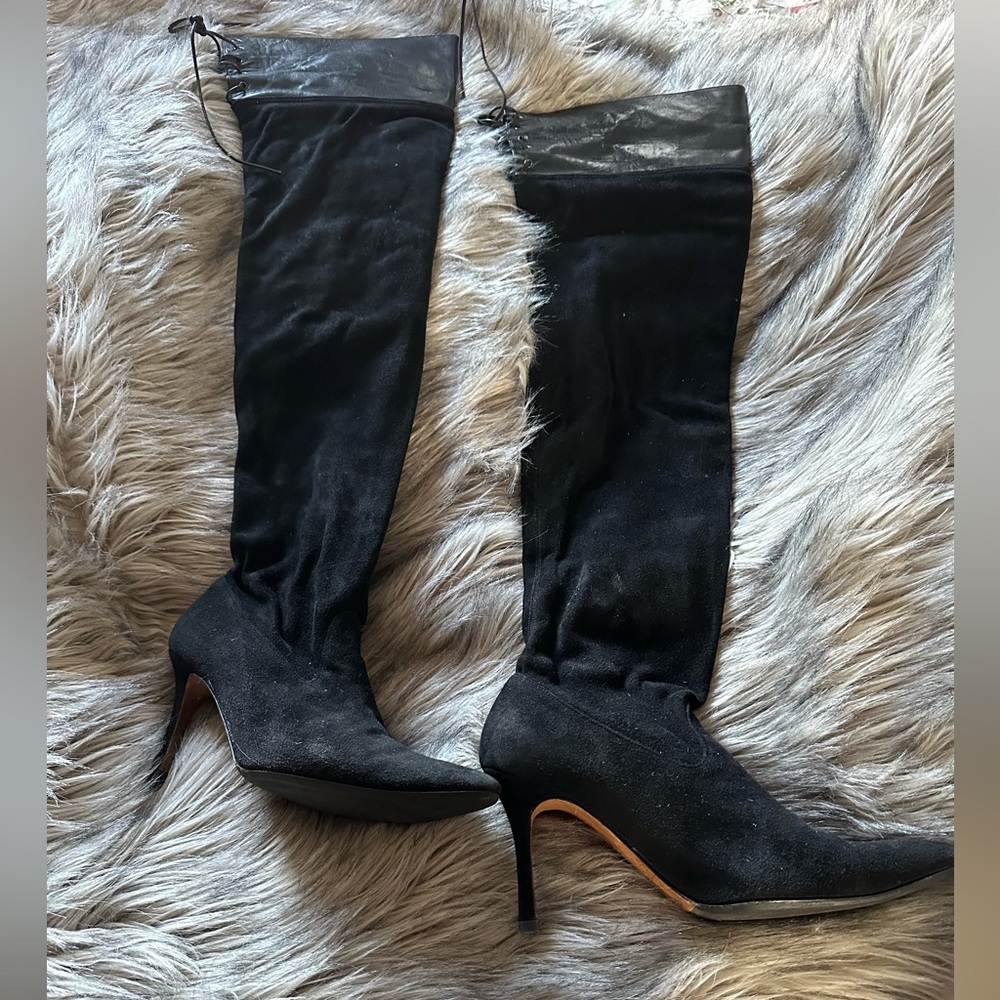 Thigh-high sexy high heel boots.